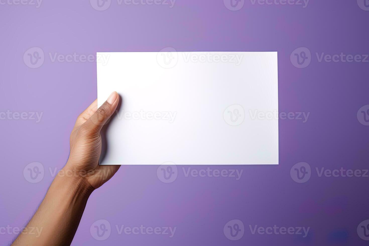 A human hand holding a blank sheet of white paper or card isolated on purple background. ai generated photo