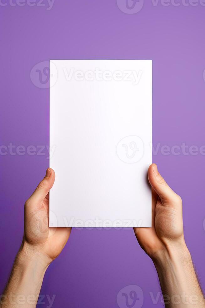 A human hand holding a blank sheet of white paper or card isolated on purple background. ai generated photo