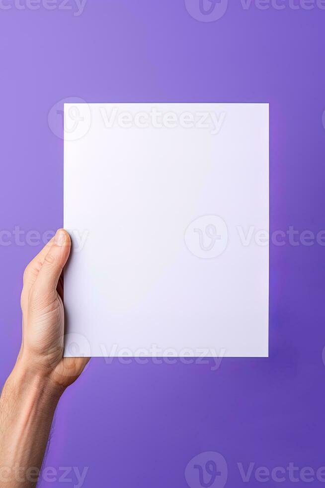 A human hand holding a blank sheet of white paper or card isolated on purple background. ai generated photo