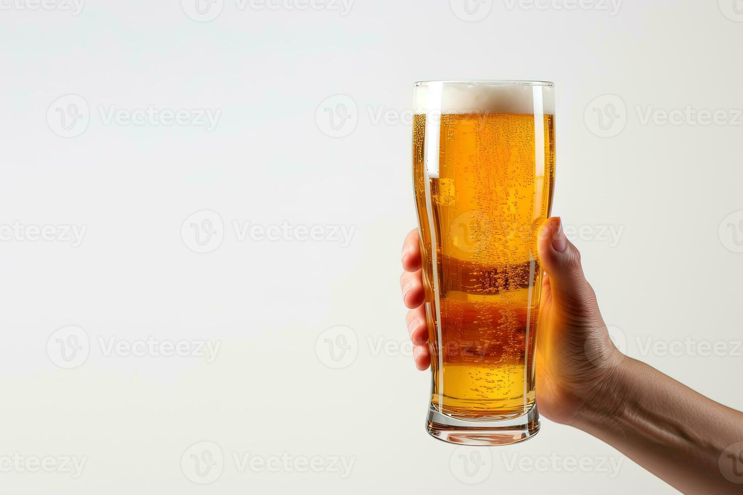 a male hand holding up a glass of beer isolated on a white background with copy space. ai generated photo