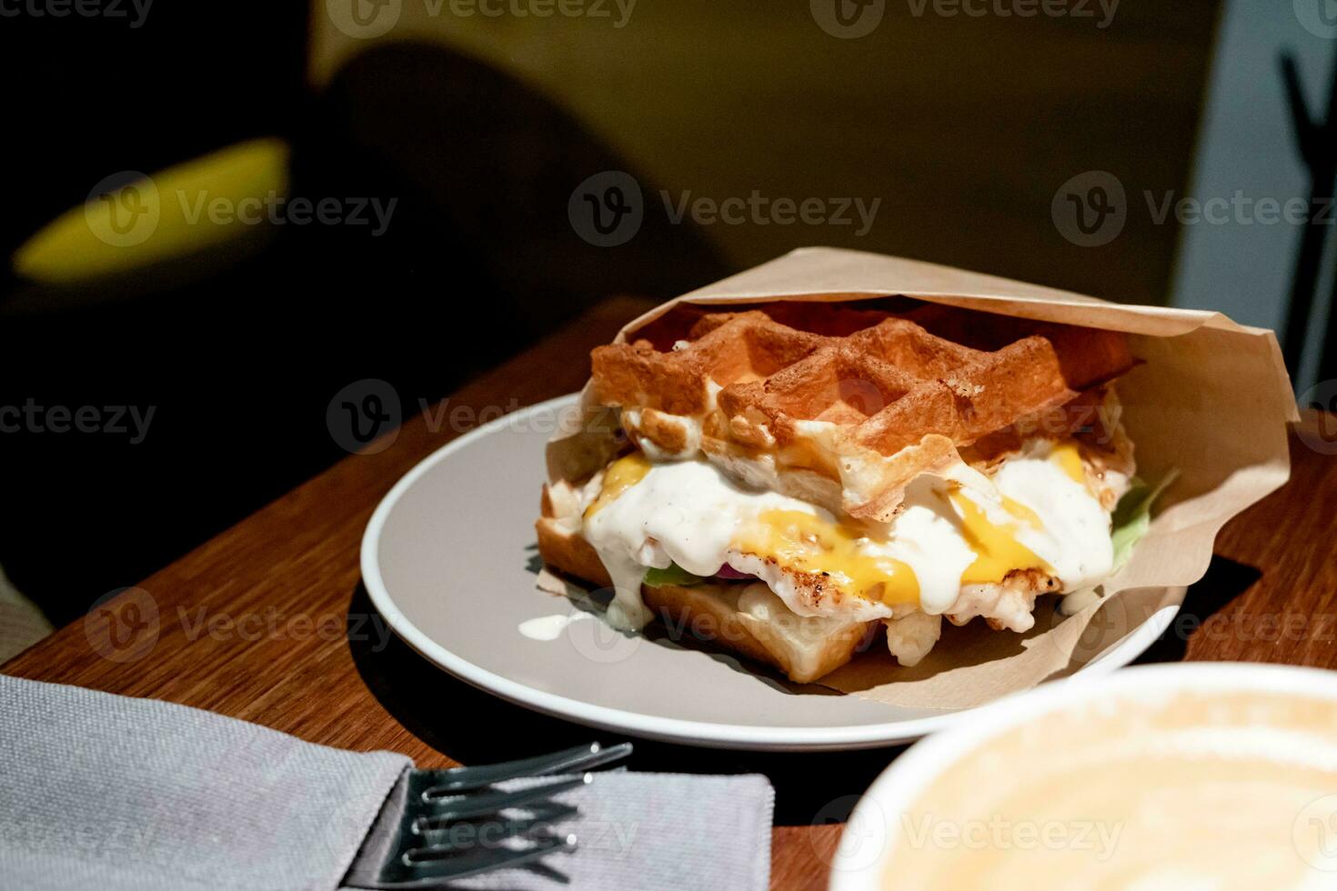 Belgian waffles with eggs and bacon. Breakfast in cafe photo