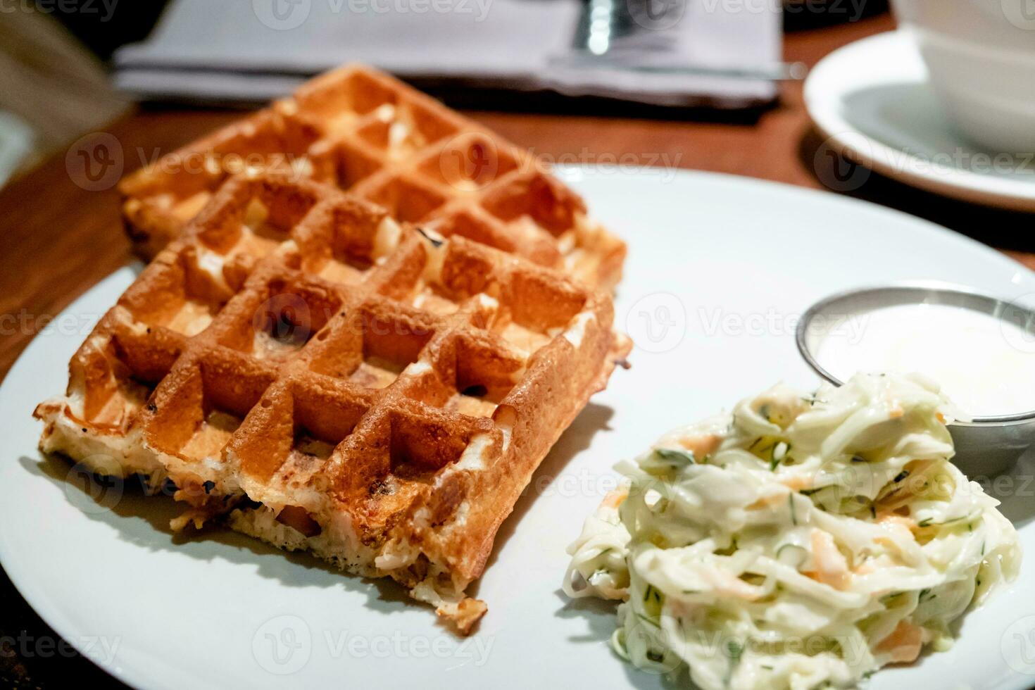 Belgian waffles with eggs and bacon. Breakfast in cafe photo