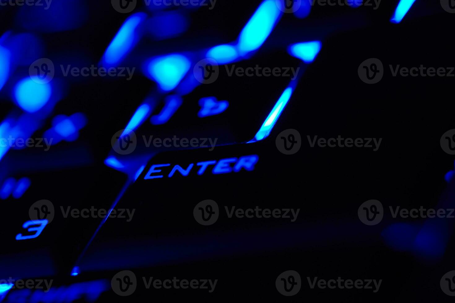 Enter key in a blue light. Macro shot. photo