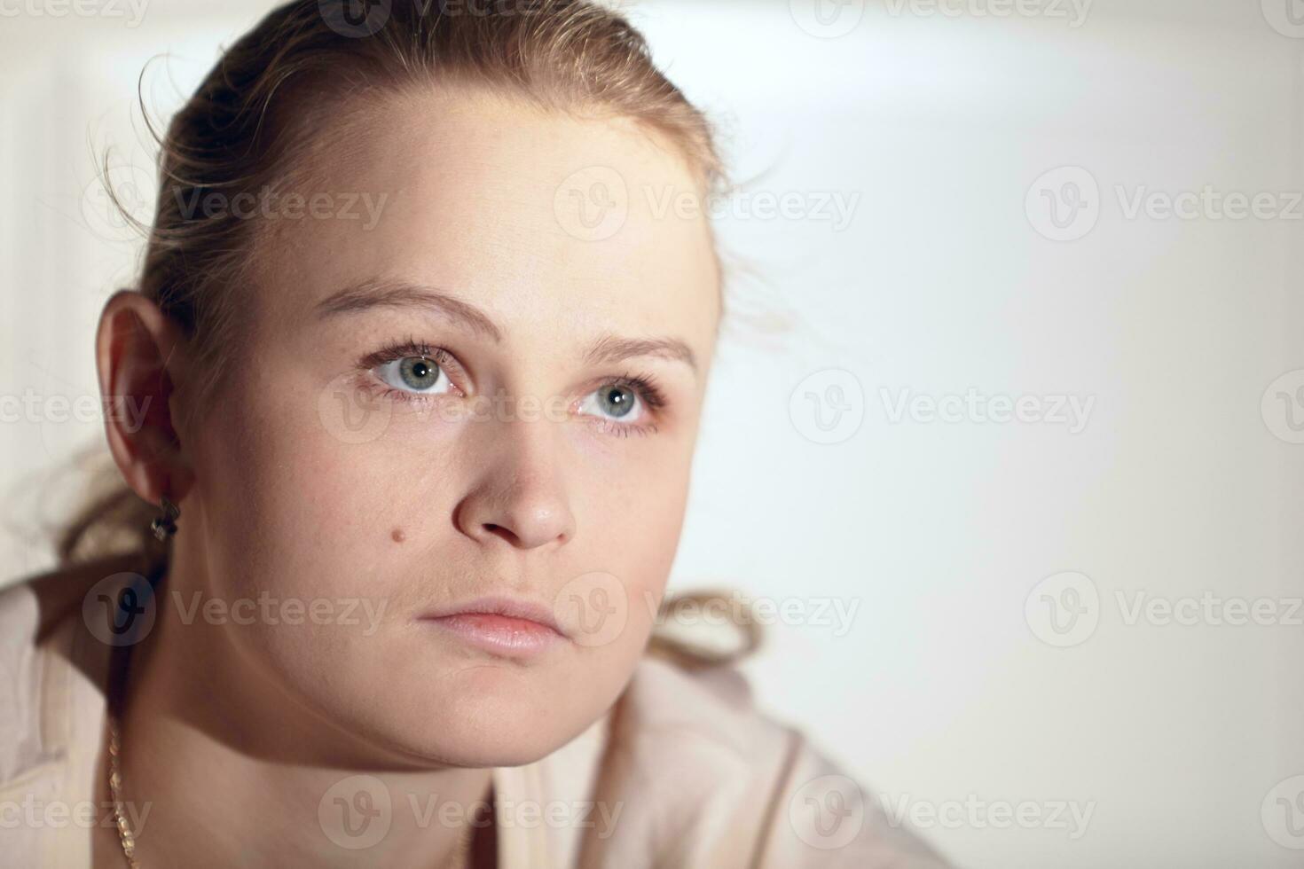 Young woman is watching an interesting film on tv. photo