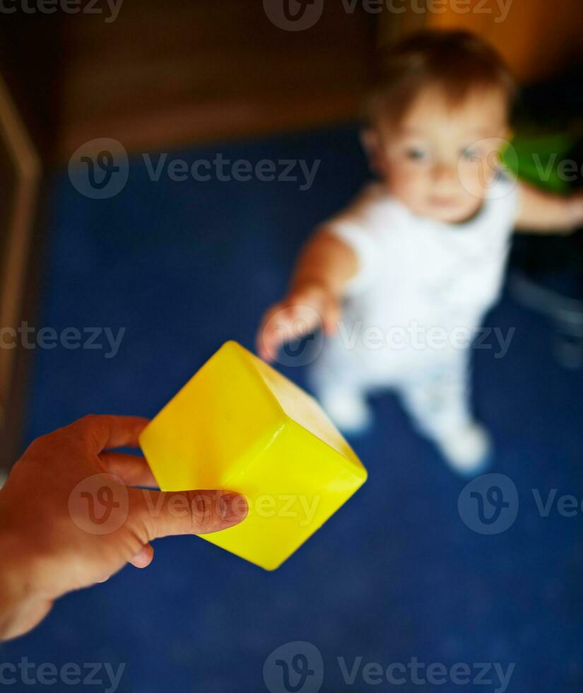 Smiling kid with toy photo