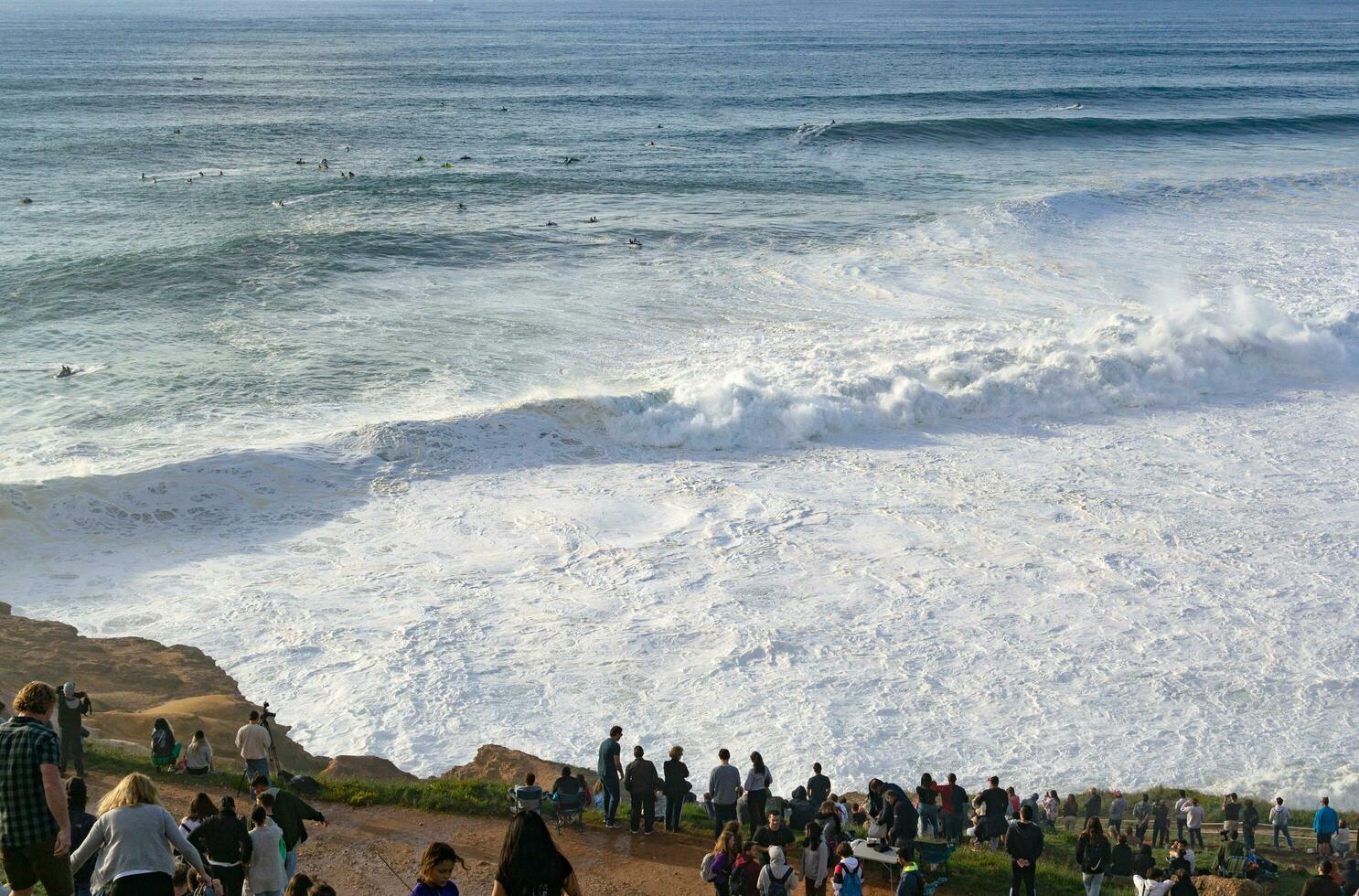 The city of Nazare in Portugal, the symbol of surfing. Coastline and view from above on the town. Tourist place with big waves. photo