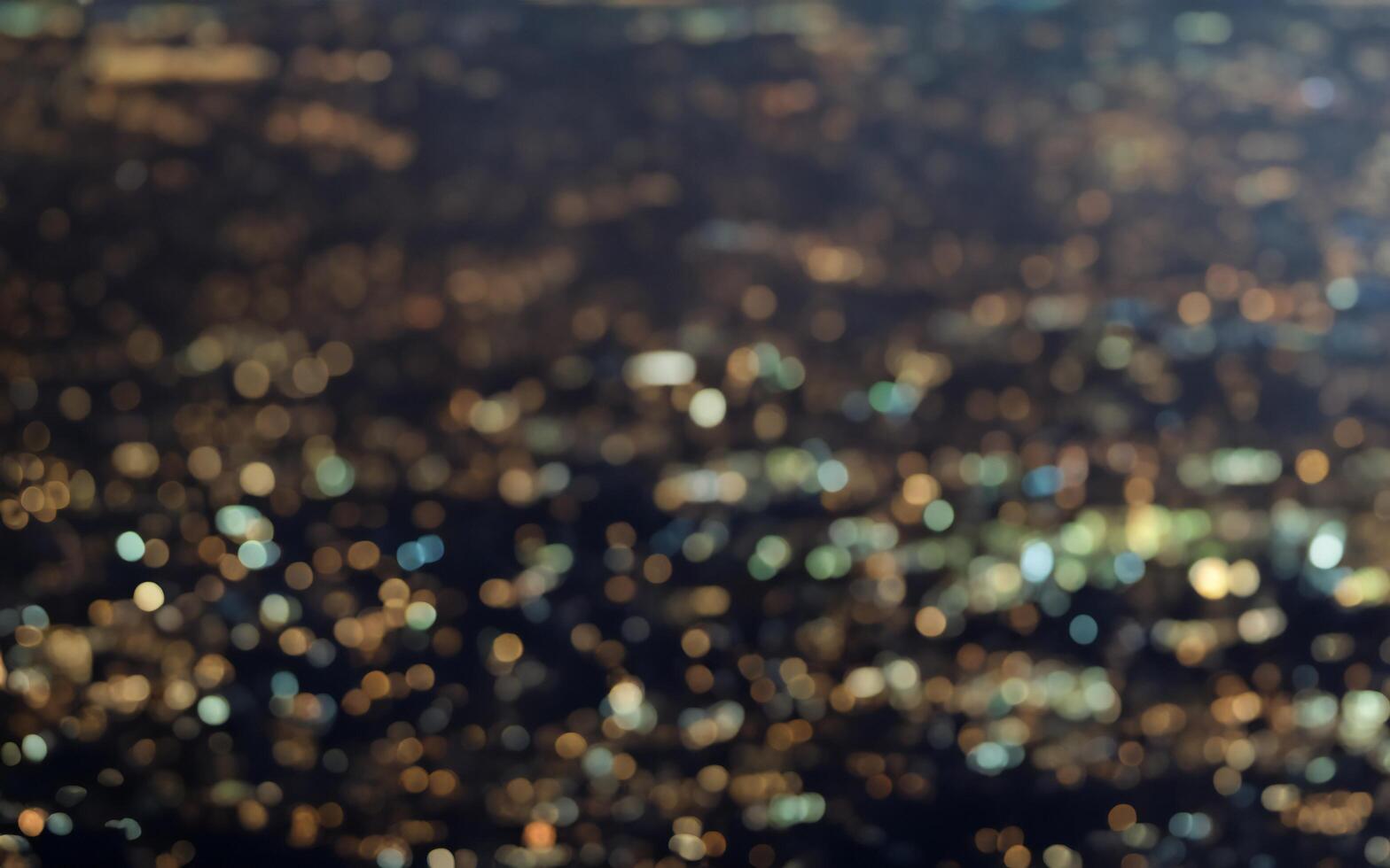 Background of abstract glitter lights with boke. Gold and black de focused boken effect. photo