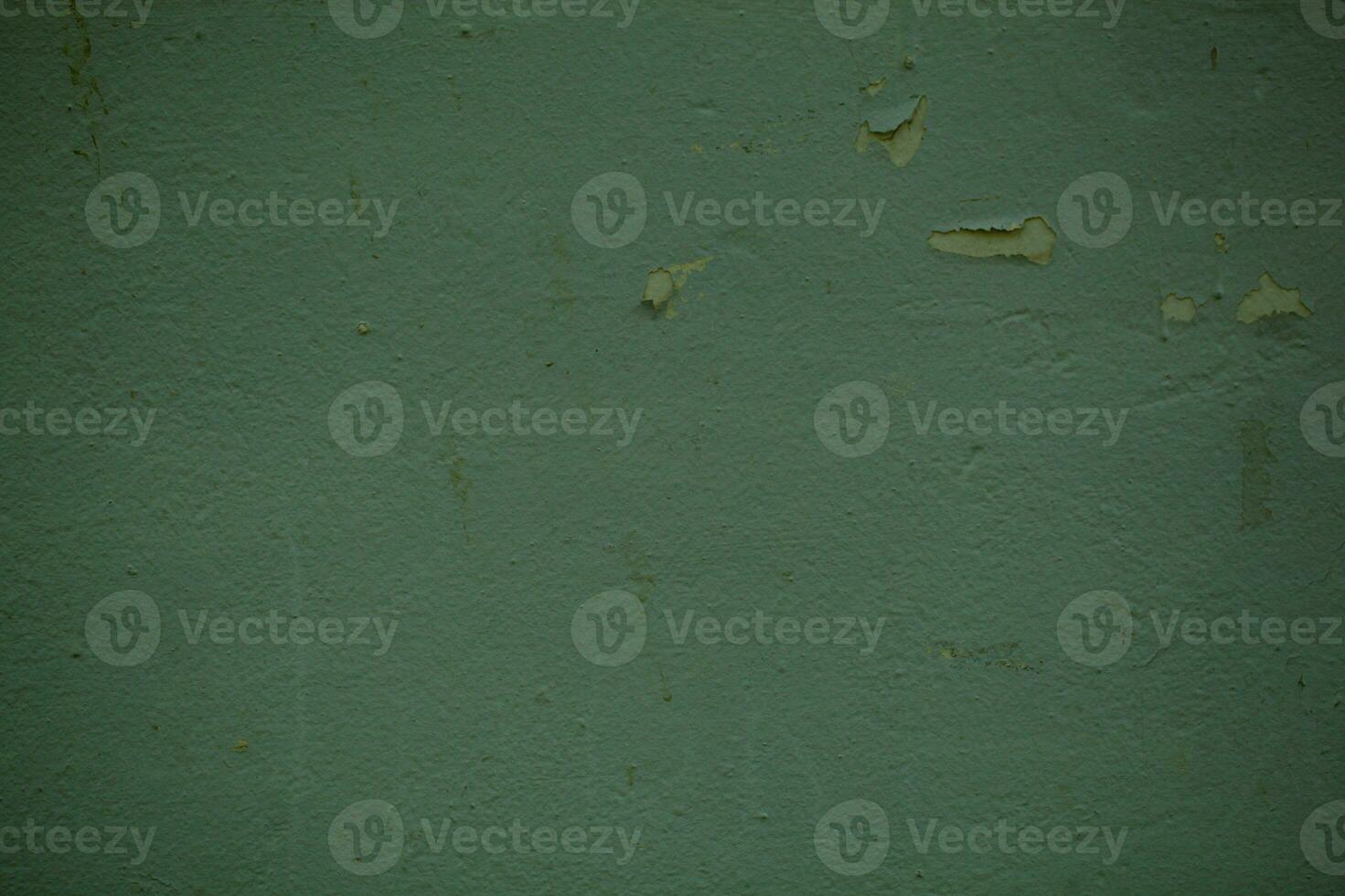 Green wall background texture with flaky paint photo