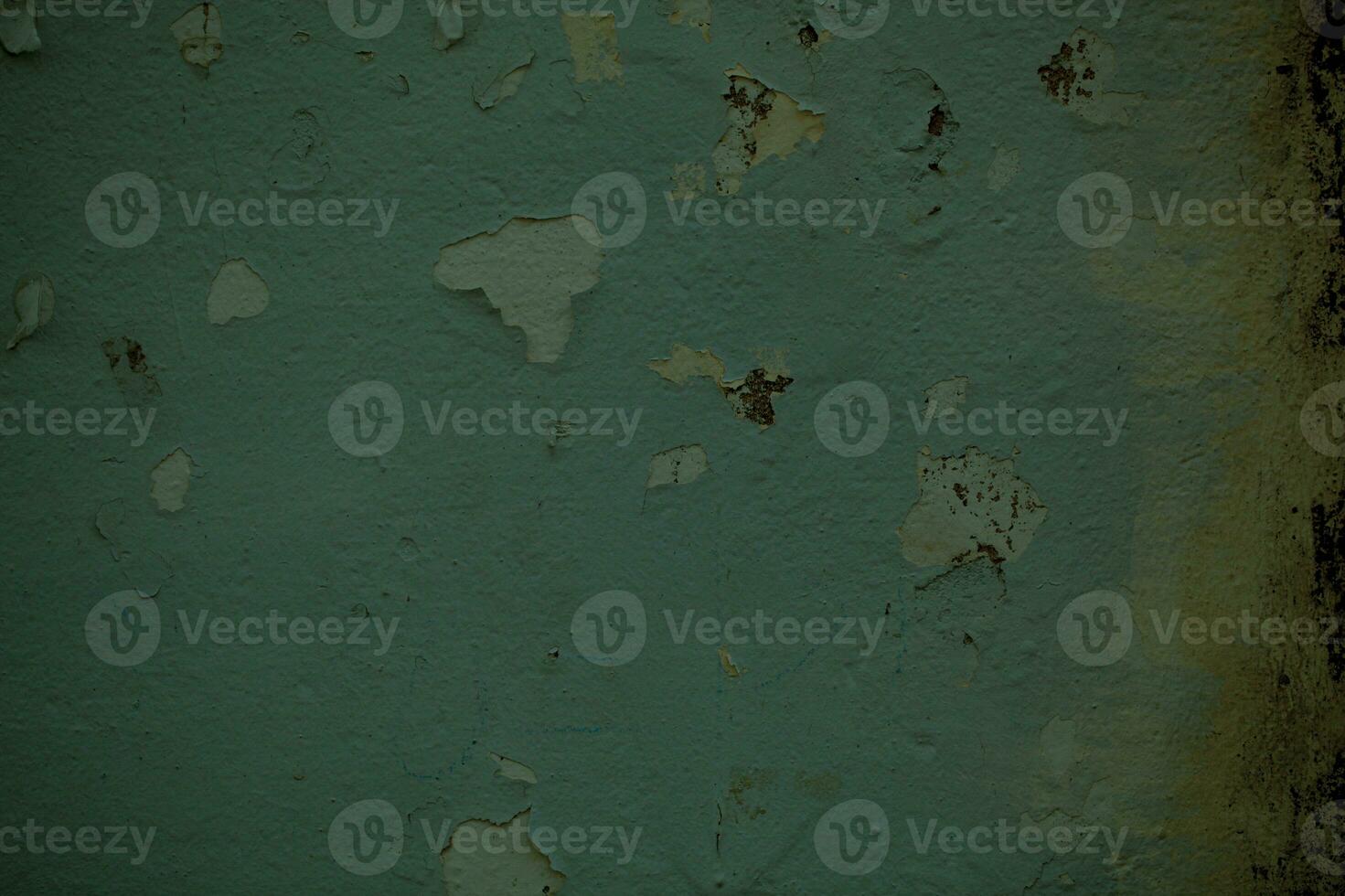Dingy green wall background texture with damp photo