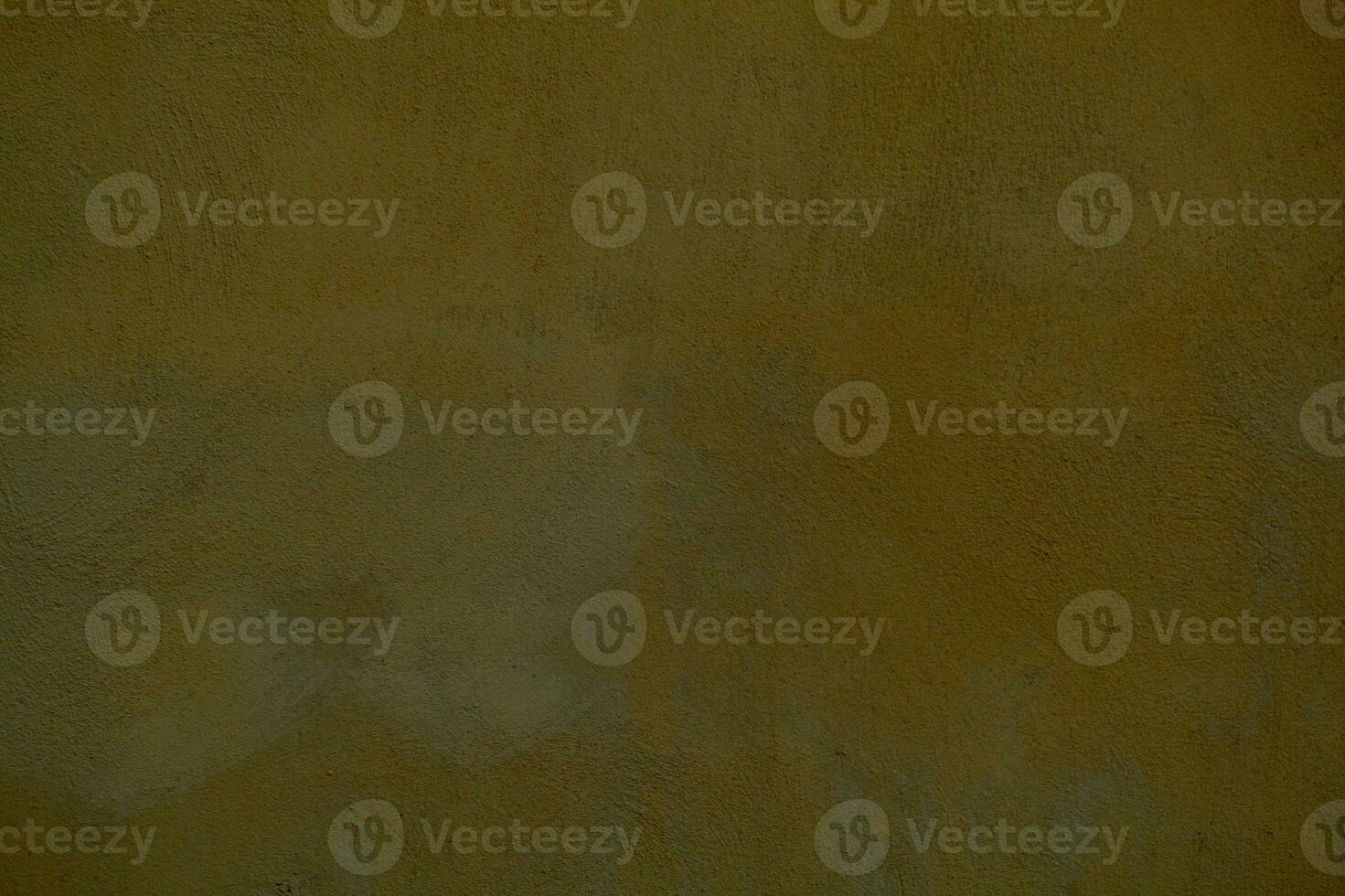 Dingy dark ochre painted wall background texture photo