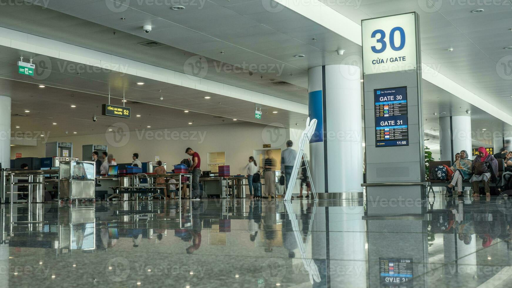 Airport hall with people in security checkpoint. Hanoi, Vietnam photo