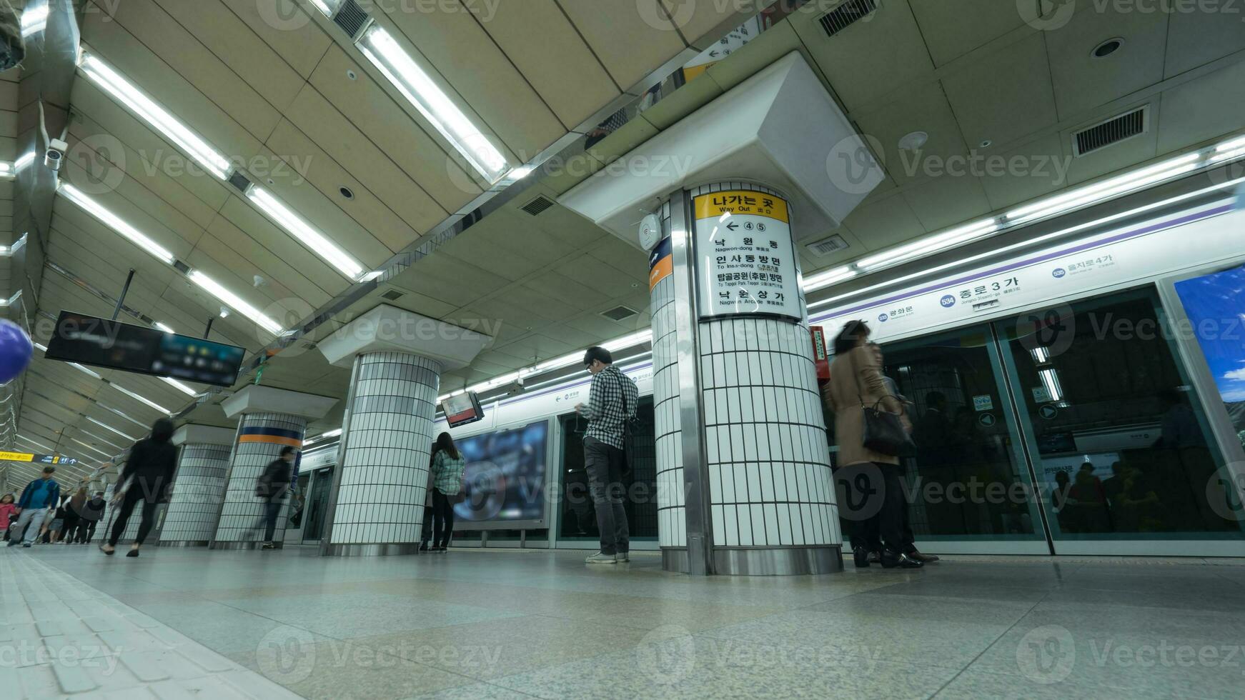 People on underground station in Seoul, South Korea photo