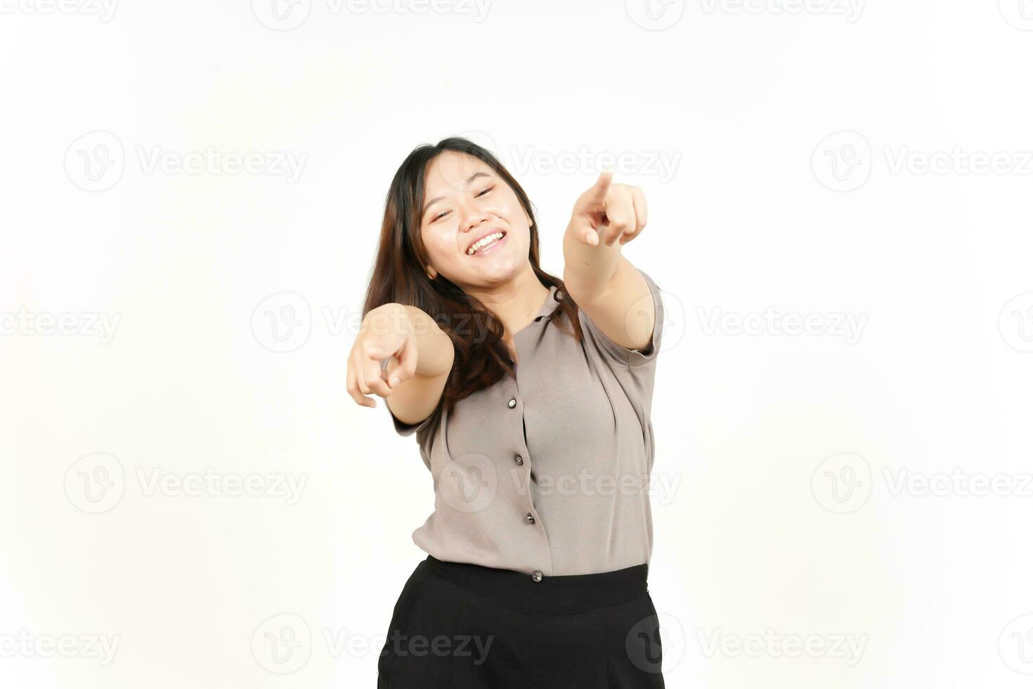 Smile and Pointing at Camera, Want You Gesture Of Beautiful Asian Woman Isolated On White Background photo