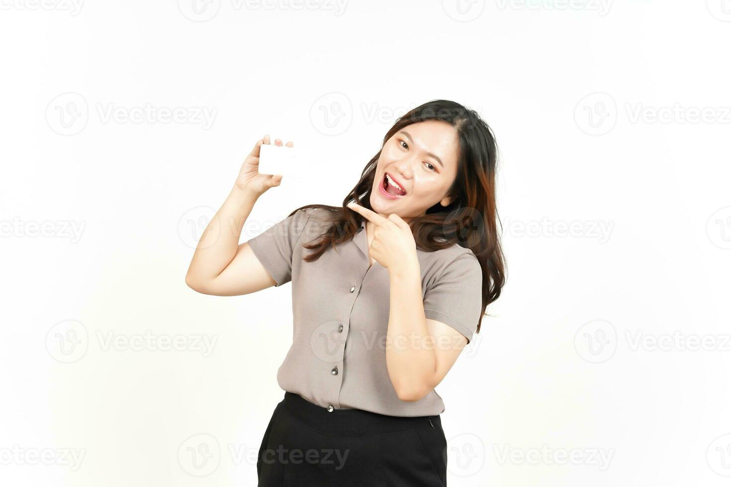 Holding and Showing Blank Credit Card Of Beautiful Asian Woman Isolated On White Background photo