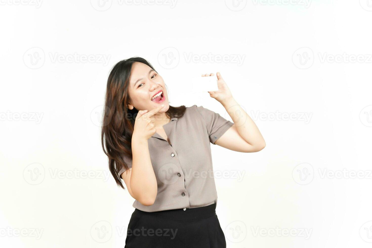 Holding and Showing Blank Credit Card Of Beautiful Asian Woman Isolated On White Background photo