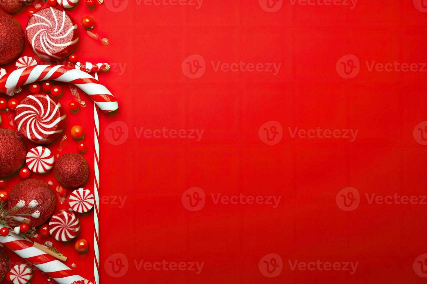 Christmas background with candy canes and red baubles on red background photo