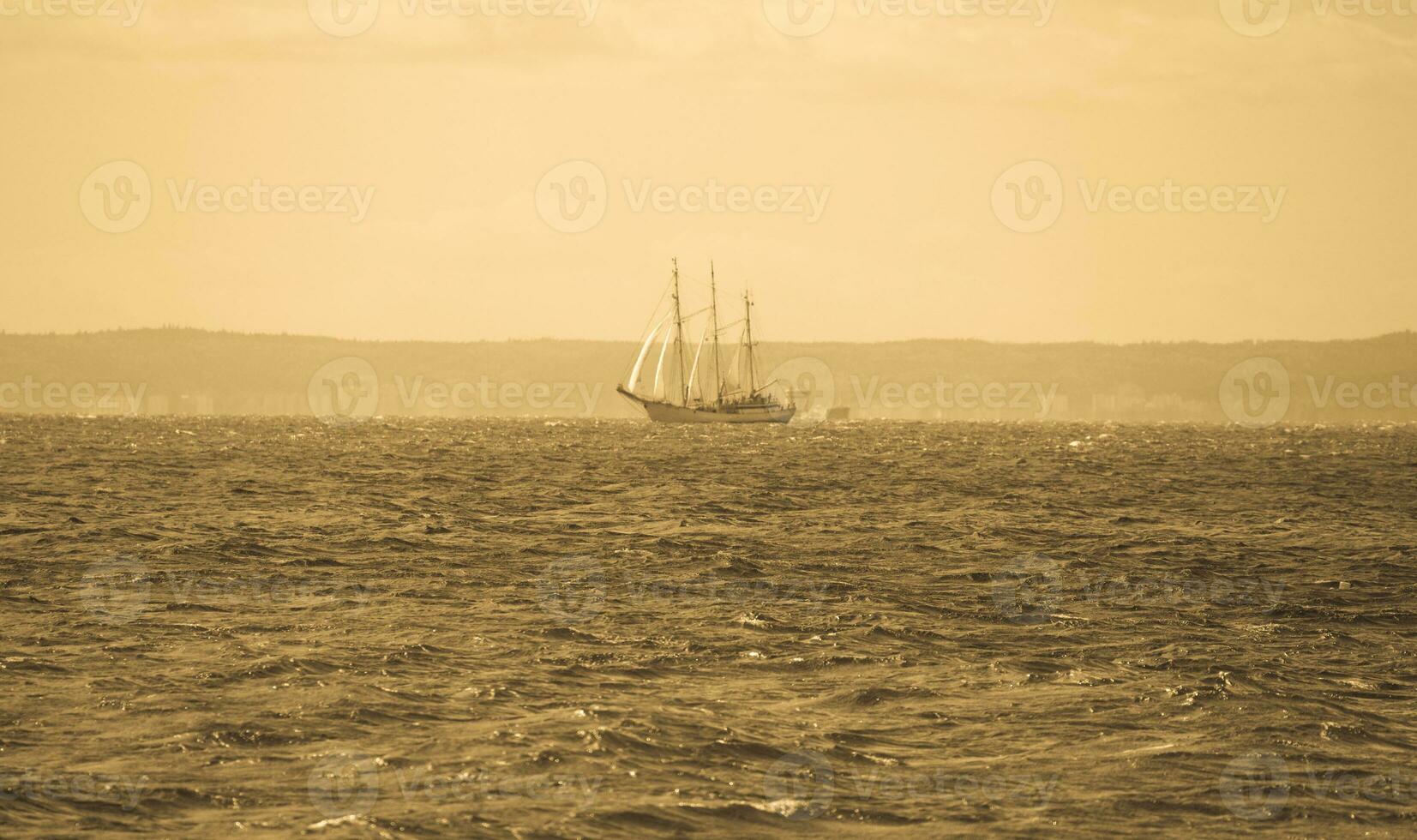 landscape with a sailing ship sailing on the blue Baltic Sea photo