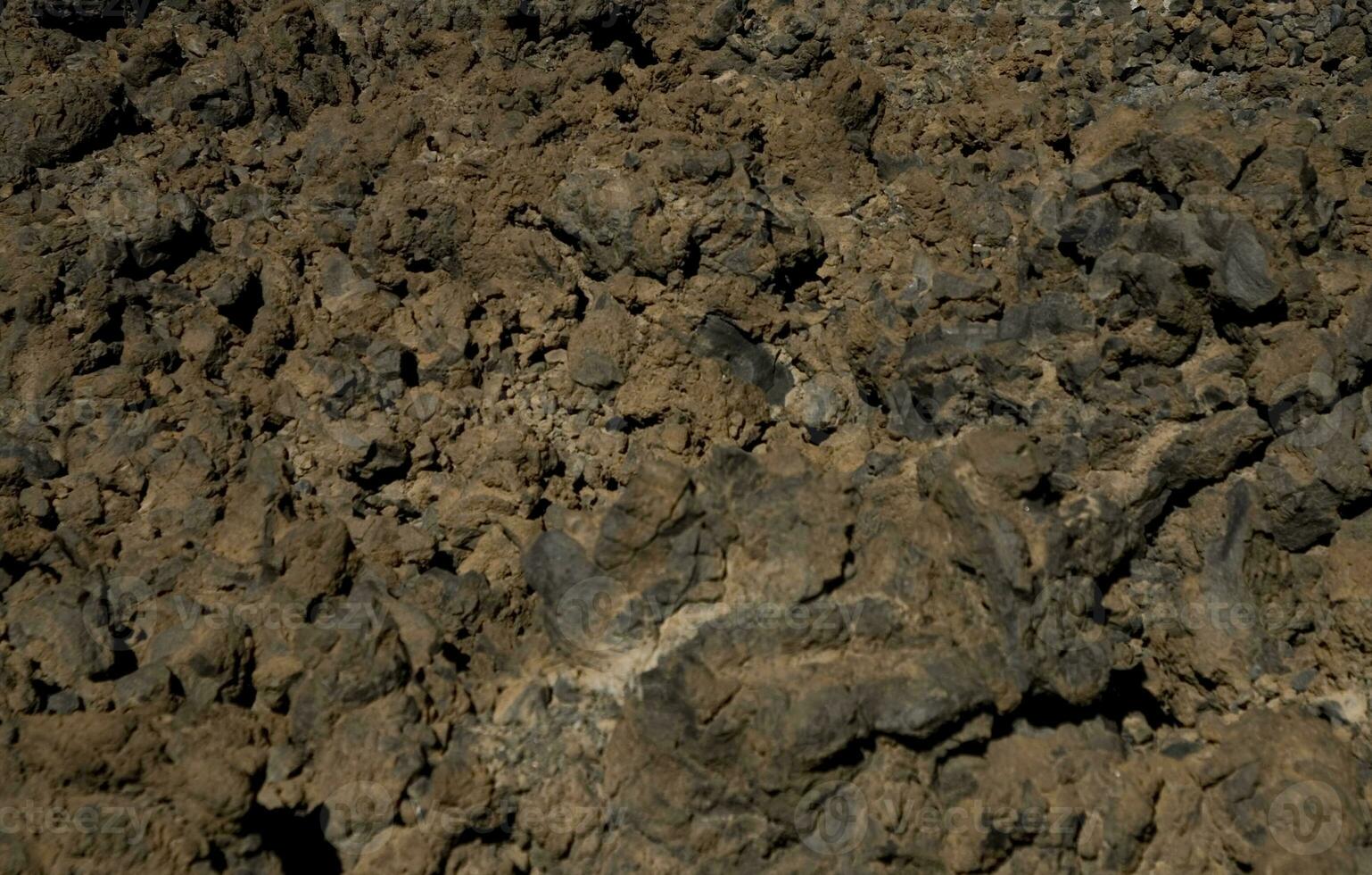 original brown natural background of volcanic congealed lava in close-up photo