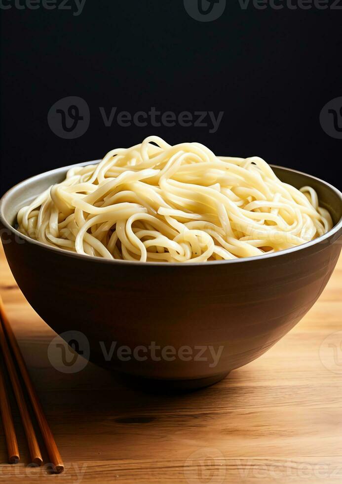 a bowl of plain noodles on a white background photo