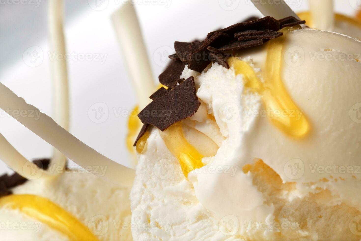 Vanilla ice cream with honey and chocolate photo