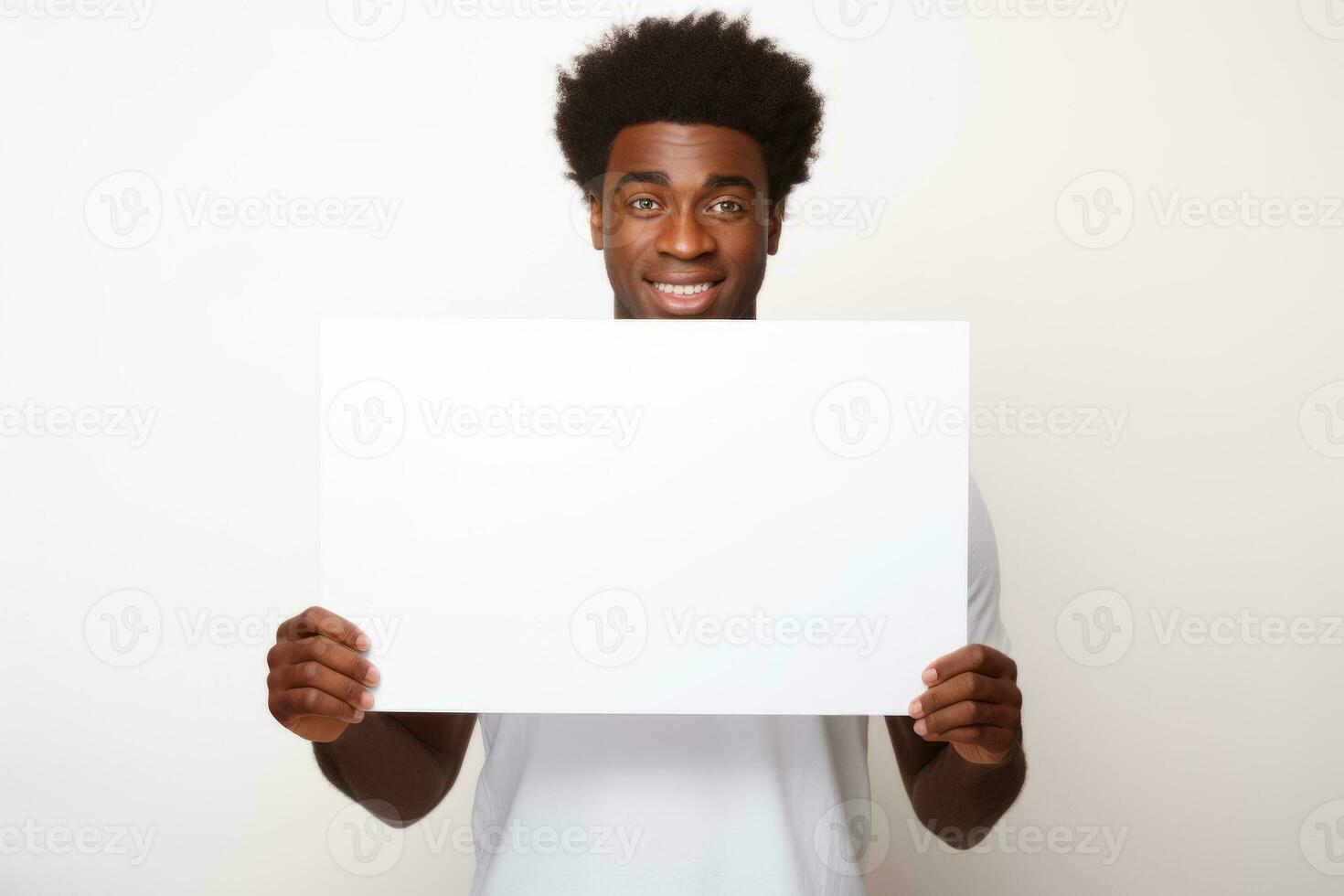 Happy young black man holding blank white banner sign, isolated studio portrait. AI Generated photo