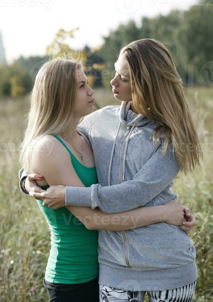 Two loving sisters comforting each other photo