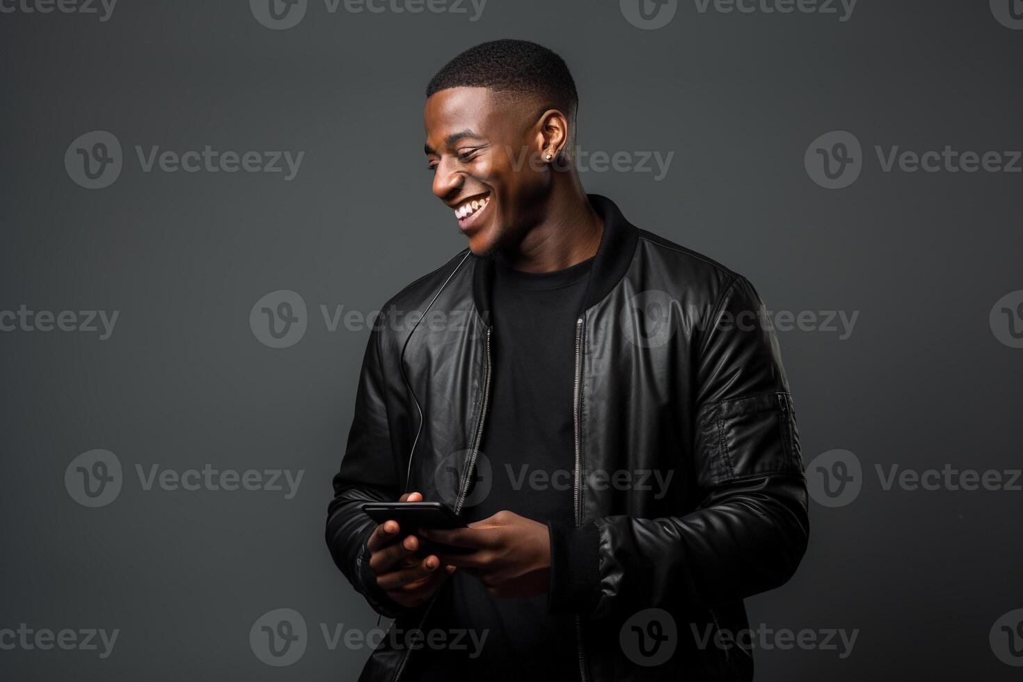 Black man with phone on studio background. photo