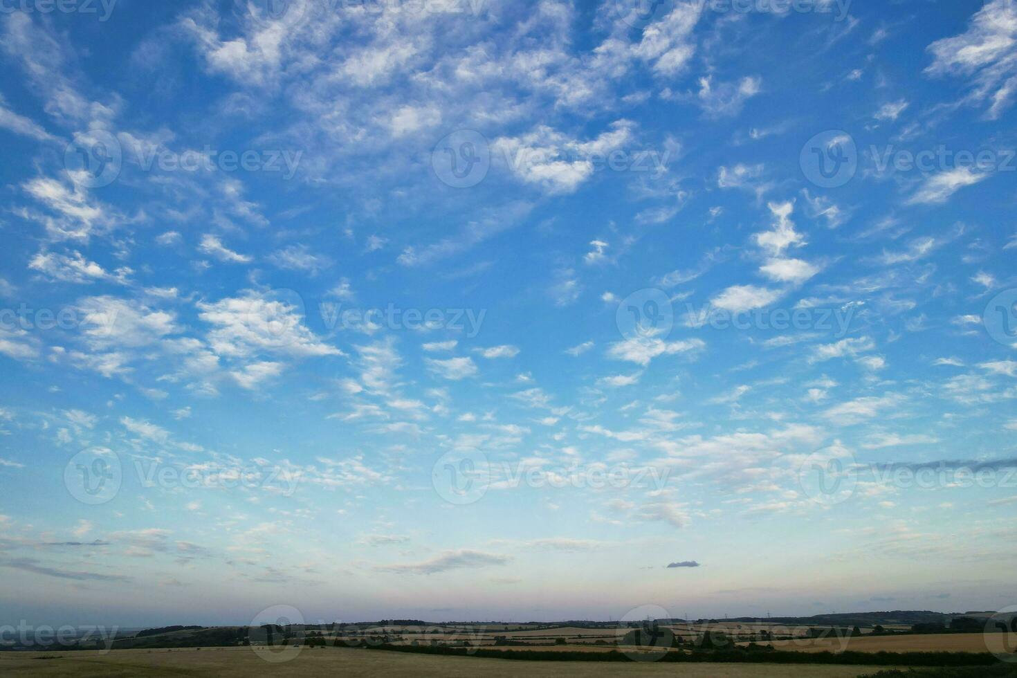 High Angle Footage of Most Beautiful Natural Orange Sunset with Orange Clouds and Sky over Luton City of England UK. Image Was Captured with drone's Camera on August 19th, 2023 photo