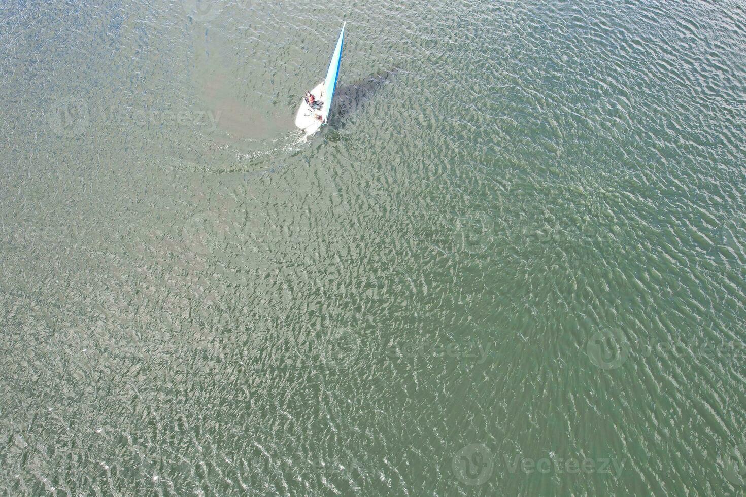 High Angle footage of People are Boating at Caldecotte Lake Located at Milton Keynes City of England Great Britain UK. The Aerial Landscape Was Captured on August 21st, 2023 with Drone's Camera photo