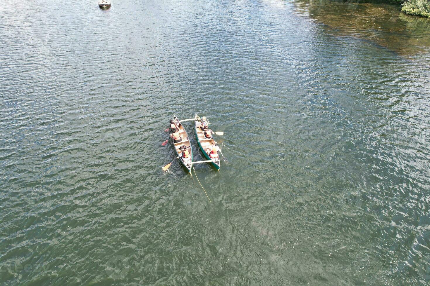 High Angle footage of People are Boating at Caldecotte Lake Located at Milton Keynes City of England Great Britain UK. The Aerial Landscape Was Captured on August 21st, 2023 with Drone's Camera photo