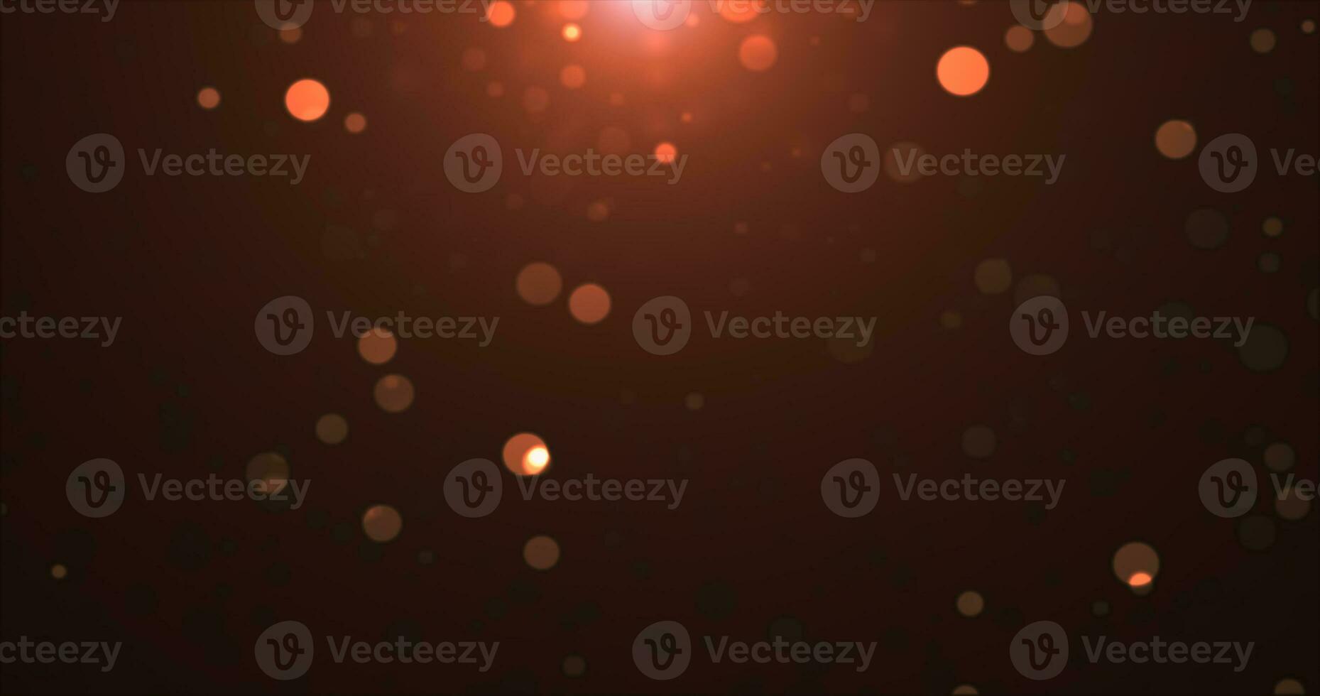 Abstract background of yellow orange gold glowing particles and bokeh dots of festive energy magic photo