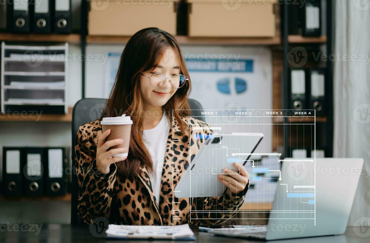 Project manager working and update tasks with milestones progress planning and Gantt chart scheduling diagram. business working with smart phone, tablet and laptop in office. photo