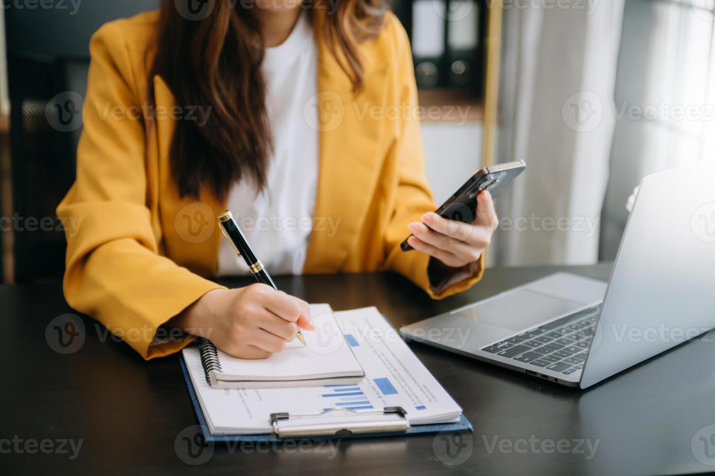 businesswoman hand working with new modern computer and writing on the notepad strategy diagram as concept morning light photo