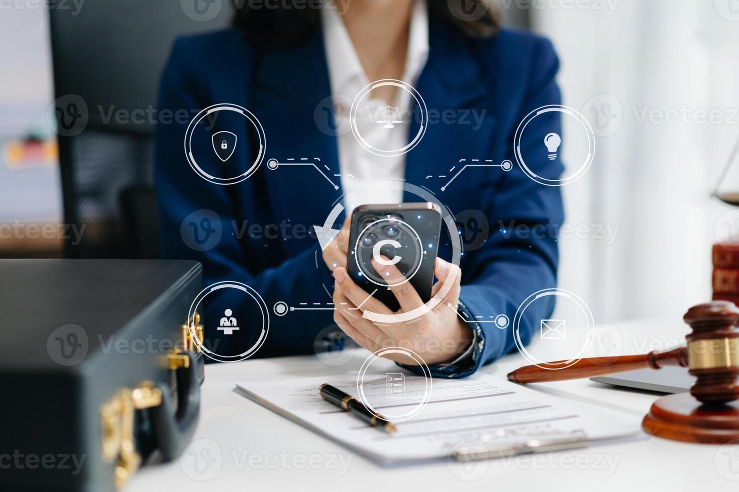 Copyright or patent concept, Person hand using laptop computer, tablet and smartphone with virtual screen copyright icon trademark, Creation ownership against piracy. at office photo