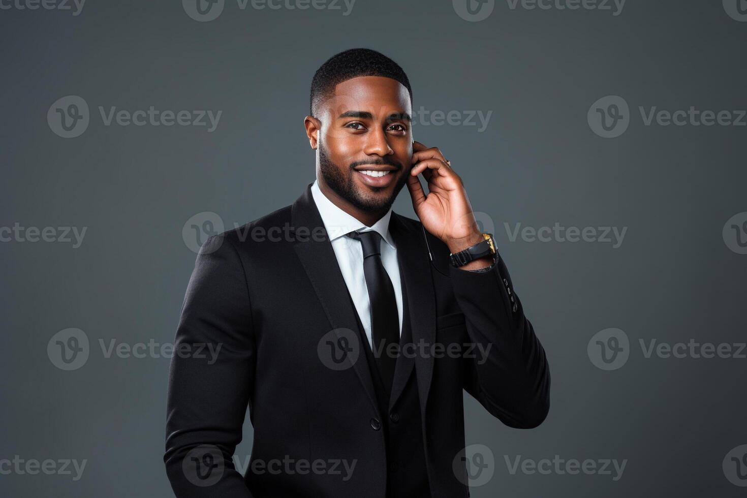 Black man with phone on studio background. photo