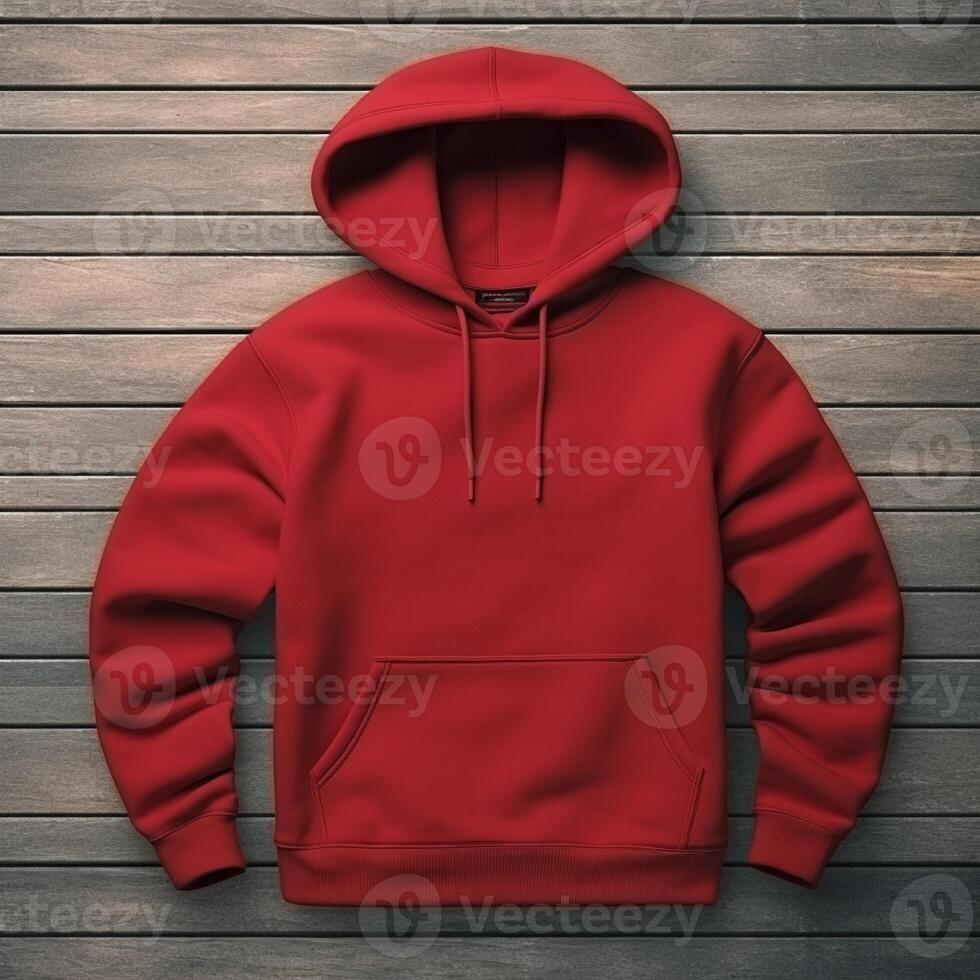 Blank red hoodie lying on the table, photographed from above photo