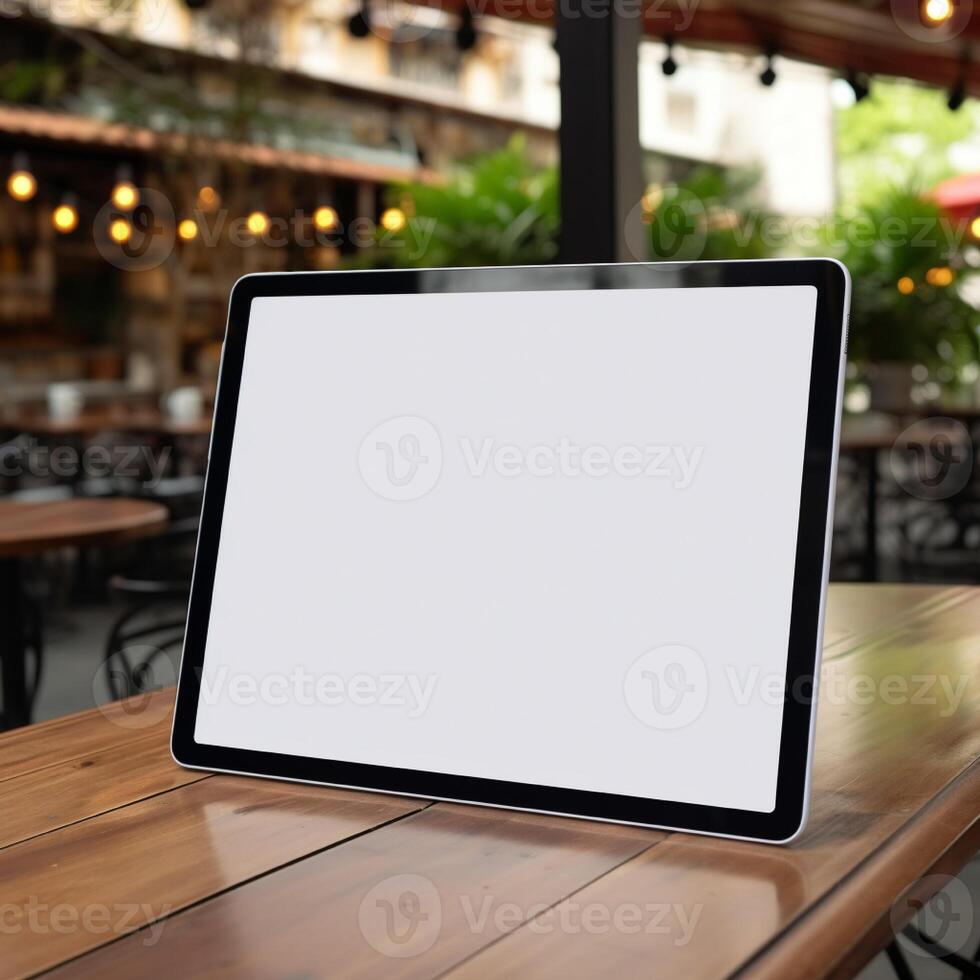High quality photo of big tablet with blank screen on the table, perfect to create mockup preview