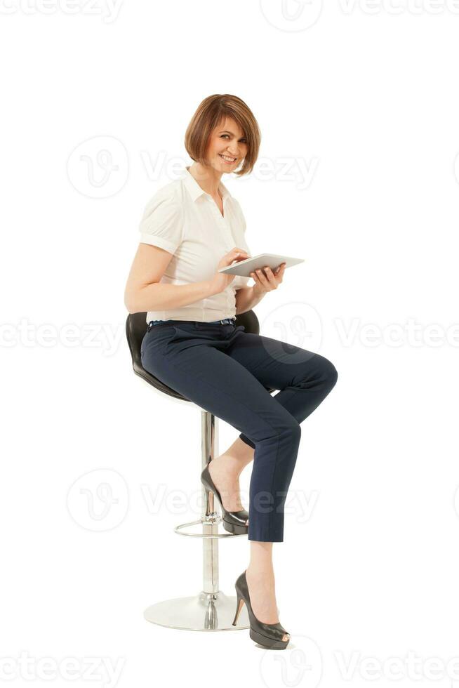 Elegant smiling woman holding tablet photo