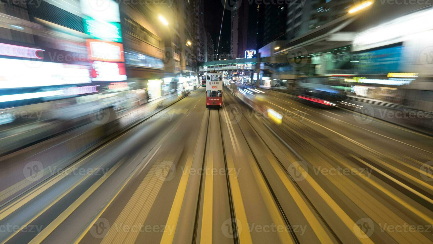 Double-decker tram on night road of Hong Kong photo