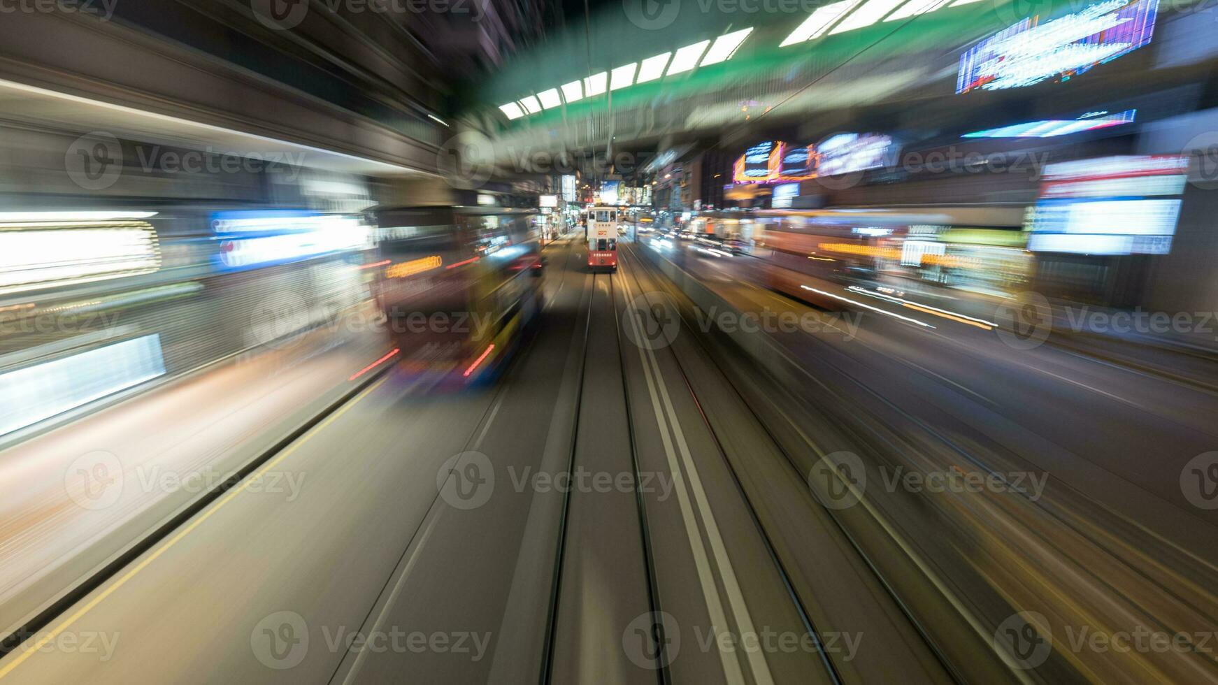 Traveling by tram in Hong Kong at night photo