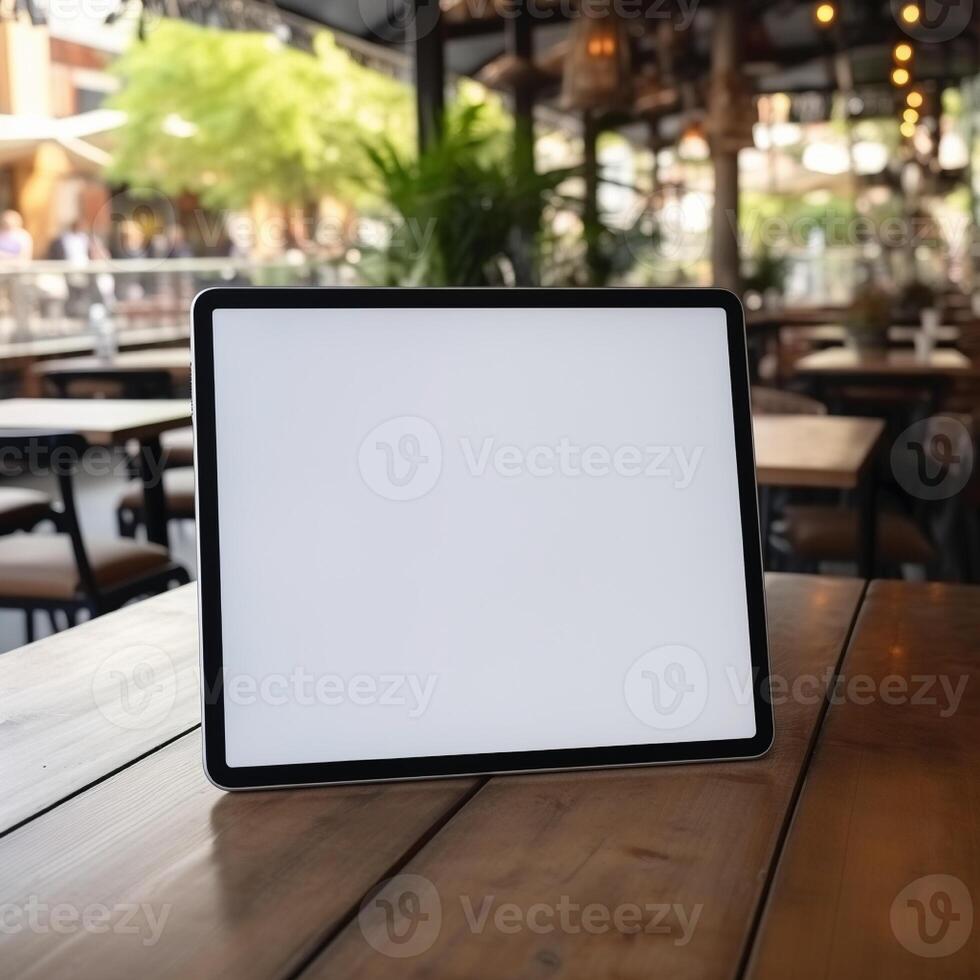High quality photo of big tablet with blank screen on the table, perfect to create mockup preview