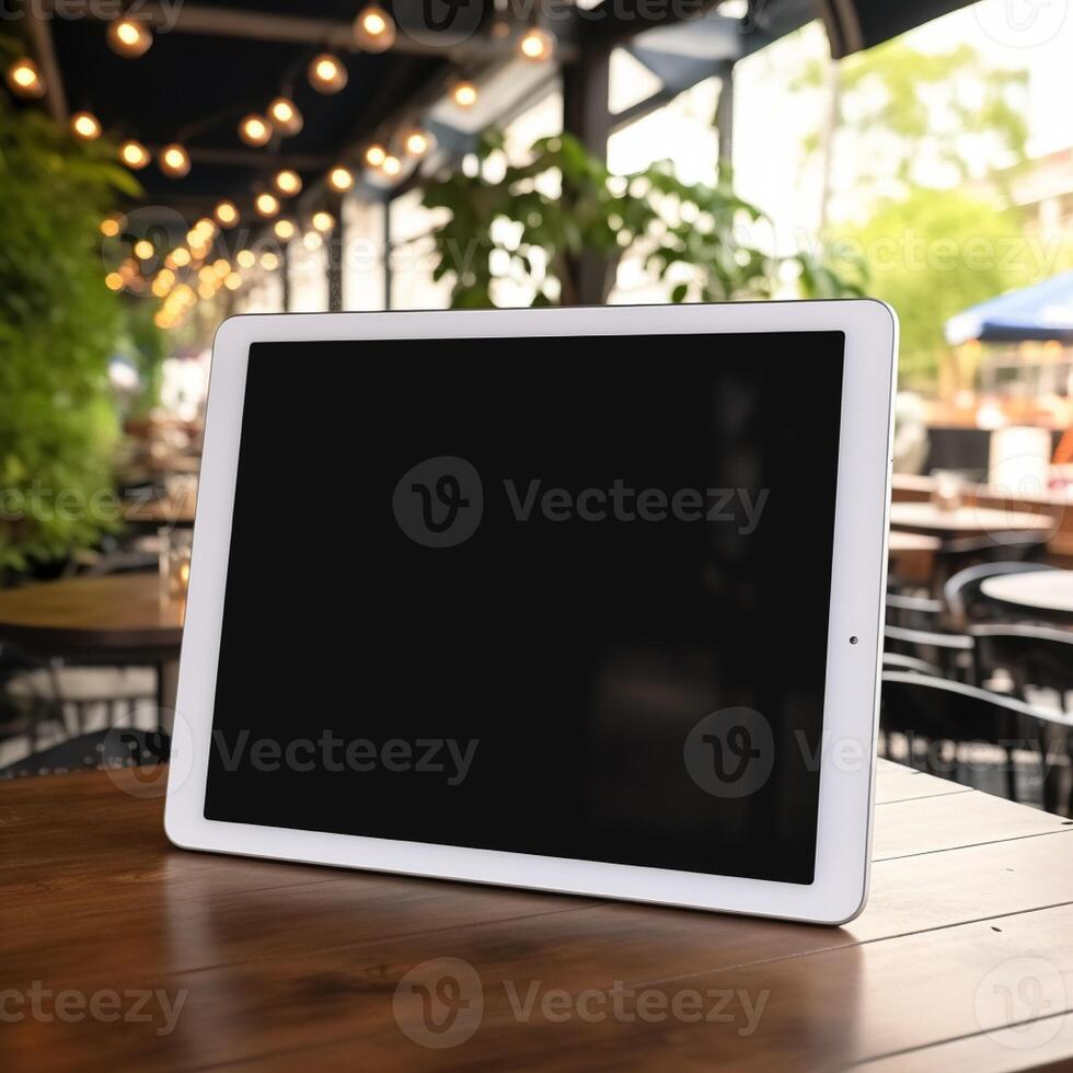 High quality photo of big tablet with blank screen on the table, perfect to create mockup preview
