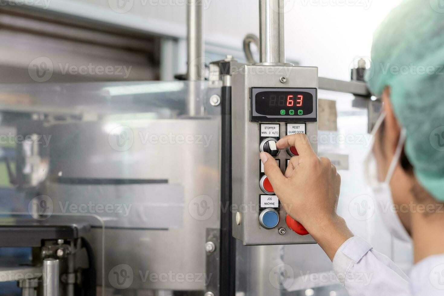 quality supervisor or food or beverages technician change parameter and condition control food or beverages before send product to the customer. Production leader recheck machine and productivity. photo
