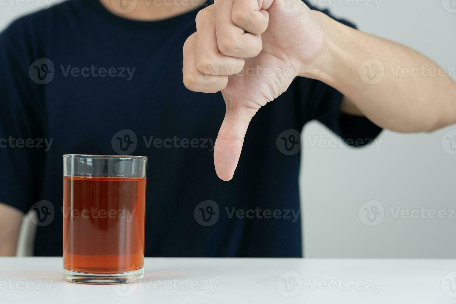 man refuses say no and avoid to drink an alcohol whiskey , stopping hand sign male, alcoholism treatment, alcohol addiction, quit booze, Stop Drinking Alcohol. Refuse Glass liquor, unhealthy, reject photo