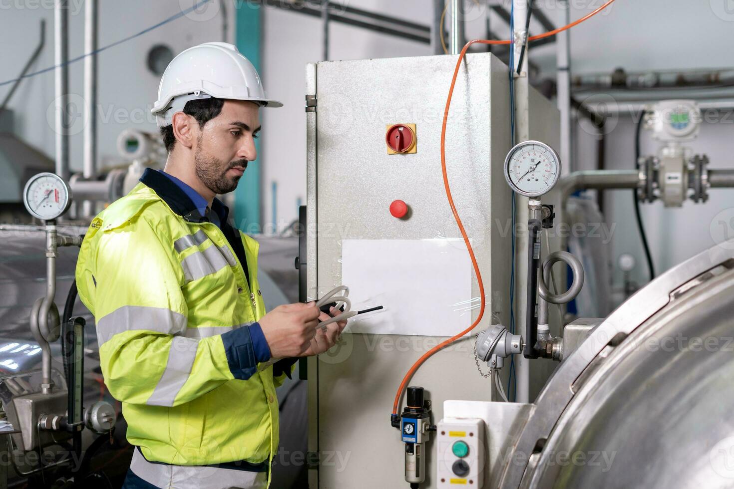 Engineers or utility staff wearing safety helmet fix the machines in the production line. Utility inspector check machine and test the system to meet the standard. machine, Preventive Maintenance photo