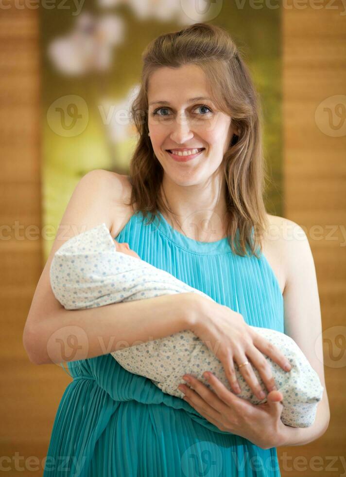 Happy Mother with Newborn photo