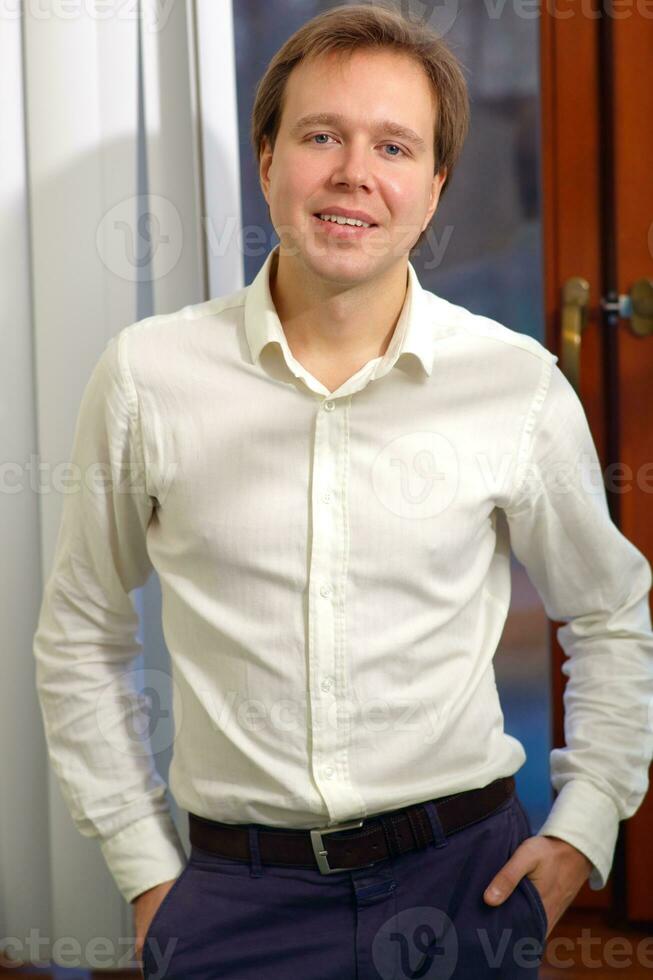 Young confident businessman indoor photo