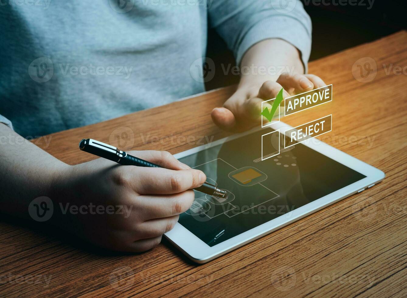 Woman writing or tick correct mark to approve document or project on digital tablet. Evaluation form, questionnaire, acceptance, approval, signing. photo