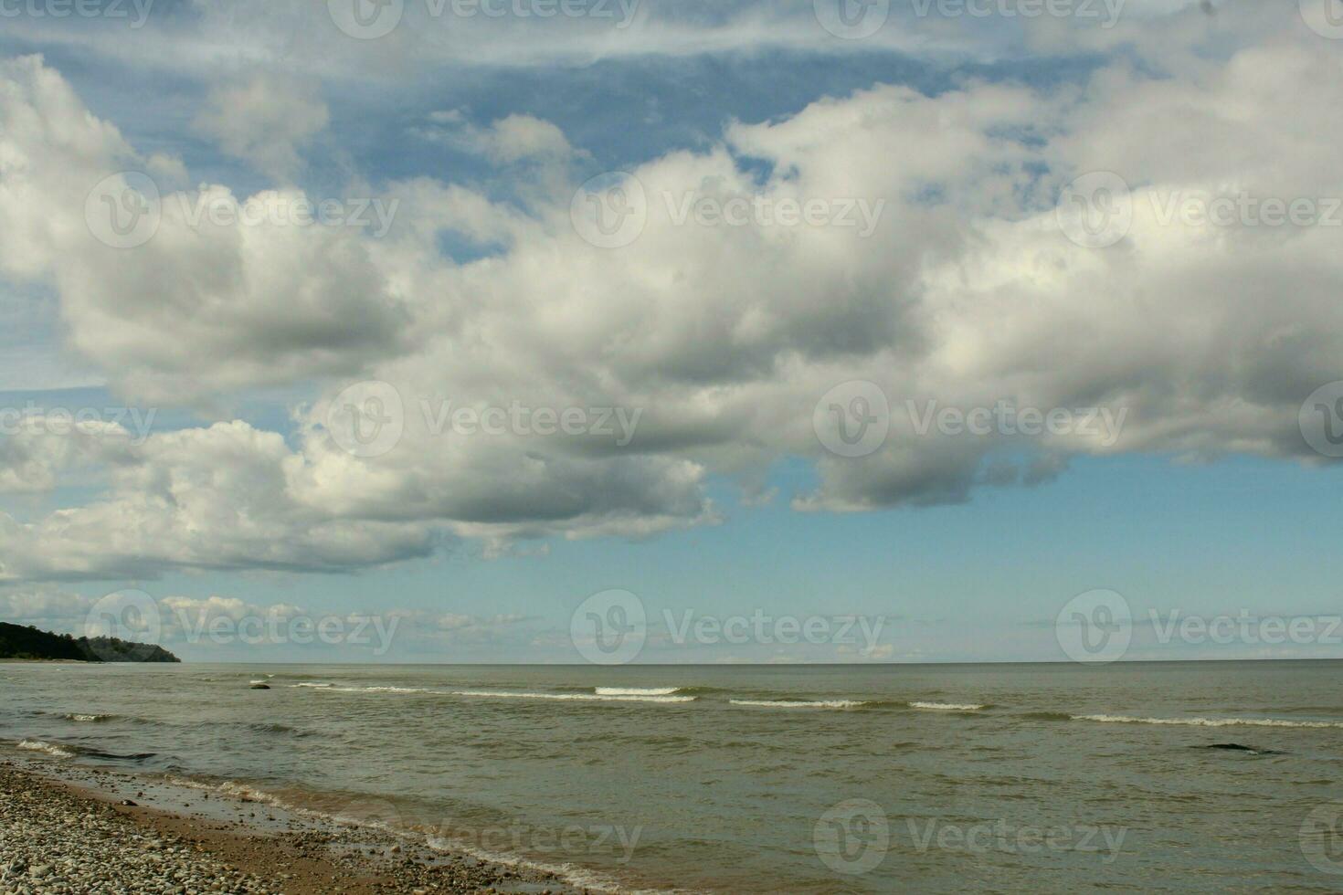 Gloomy sky above the sea. Rainy clouds on the horizon above the water. Nature background. photo