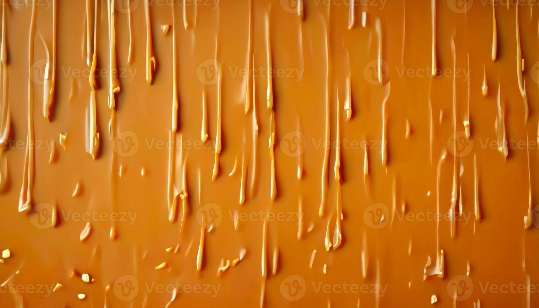Delicious melted caramel texture. Flow, wave and drops splash caramels sauce. Sweet food design background. photo